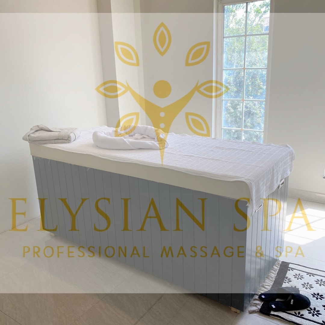 Serene massage room at Elysian Spa & Massage Center in F7 Islamabad featuring a comfortable bed